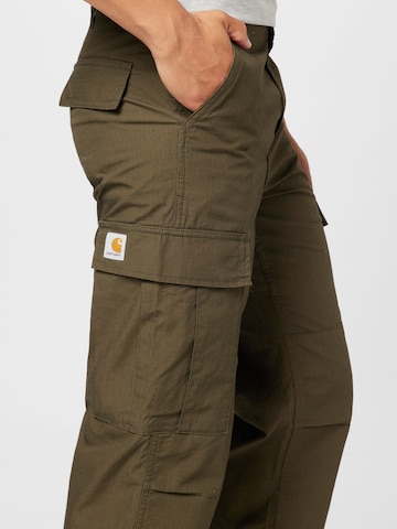 Carhartt WIP Regularen Kargo hlače | zelena barva