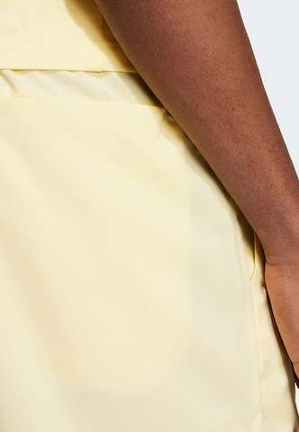 ADIDAS SPORTSWEAR Regular Workout Pants 'Essentials Chelsea' in Yellow