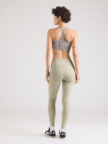 PUMA Skinny Sportbroek 'Essential' in Groen