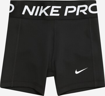 NIKE Skinny Workout Pants in Black: front