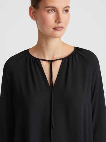 Minx Bluse‌‌‌‌‌‌‌‌‌ in Schwarz