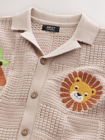 Next Neuletakki värissä beige