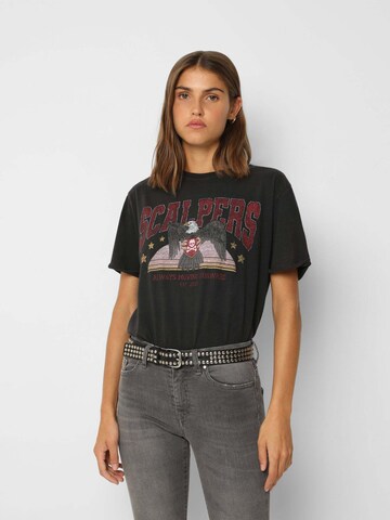 T-shirt Scalpers en noir : devant