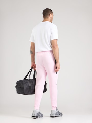 Nike Sportswear - Tapered Pantalón 'TCH FLC' en rosa