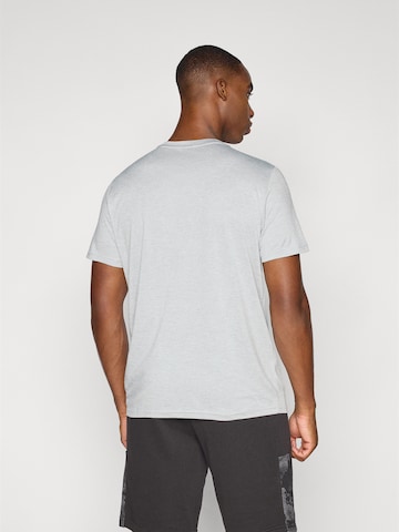 PUMA Performance shirt 'TAD ESSENTIALS HEATHER' in Grey