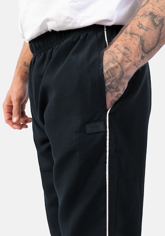 Effilé Pantalon de sport Hero en bleu
