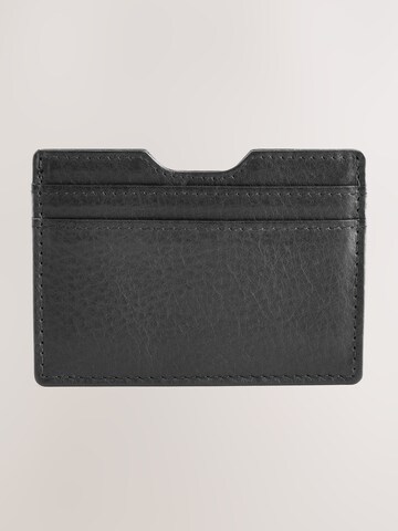 Next Puzdro - Čierna: predná strana