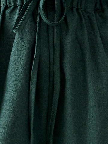 Calli Jumpsuit 'CONSCIOUS' i grønn