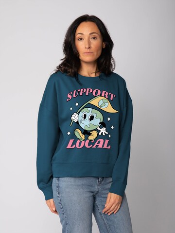 Watapparel Sweatshirt 'Support Local ' in Green: front