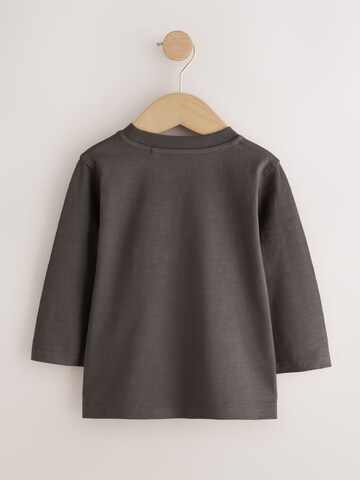 Tricou de la Next pe bej