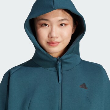 ADIDAS SPORTSWEAR Urheilullinen collegetakki 'Z.N.E. ' värissä sininen