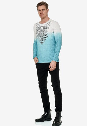 Rusty Neal Longsleeve mit großem Front- Print in Blau