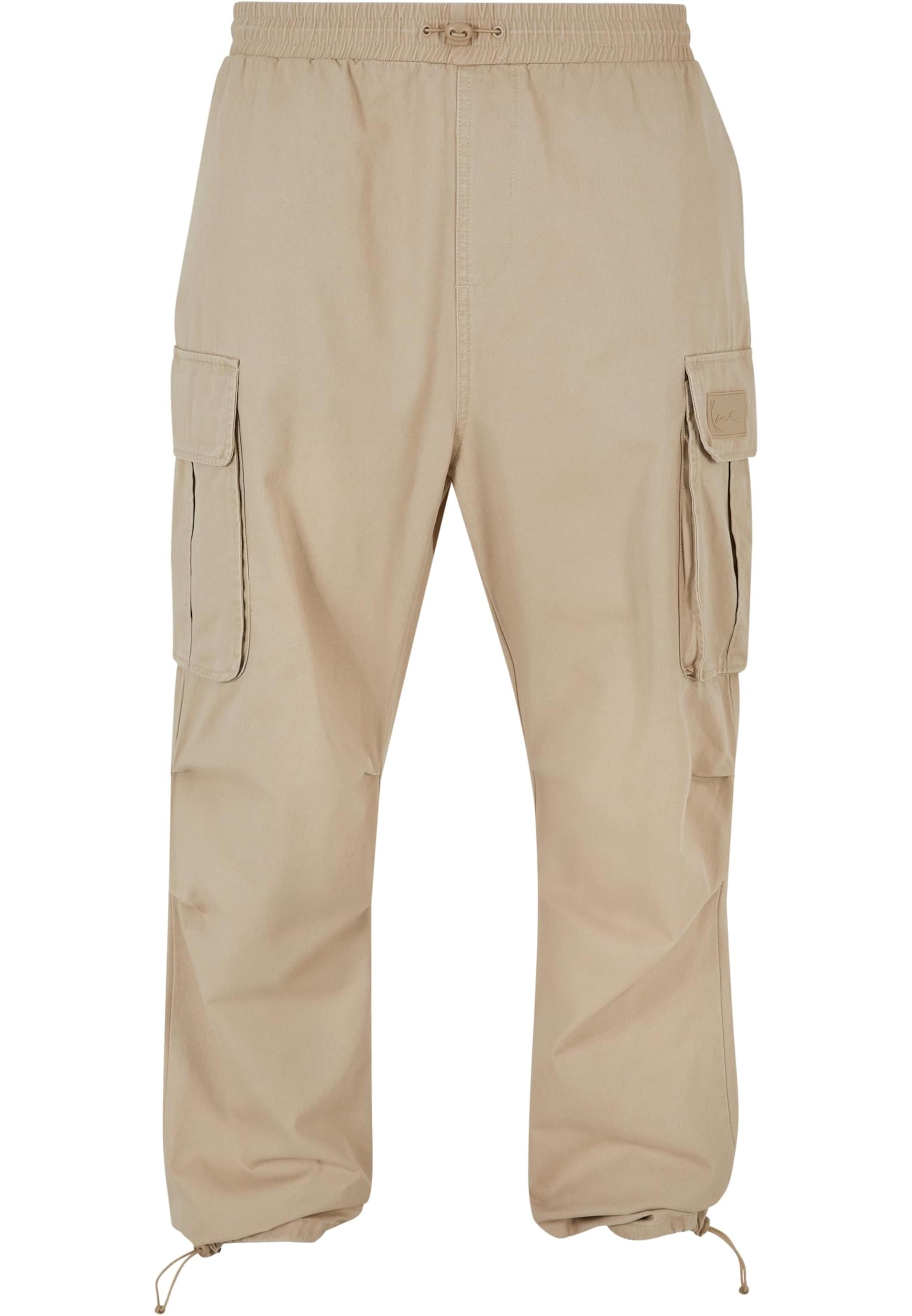 Karl Kani Loose fit Cargo trousers in Beige: front