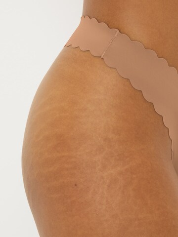 Next String i beige