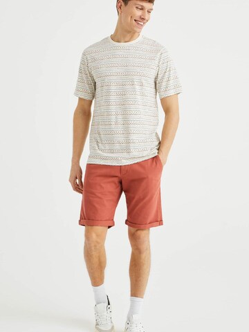WE Fashion - Slimfit Calças chino em vermelho