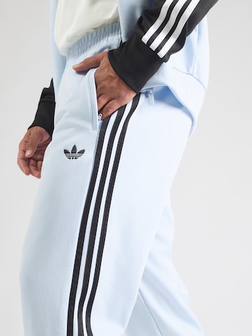 ADIDAS ORIGINALSTapered Hlače 'SST' - plava boja