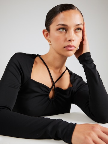 Sisley - Blusa en negro