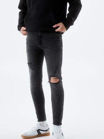 Tapered Jeans de la Pull&Bear pe negru: față