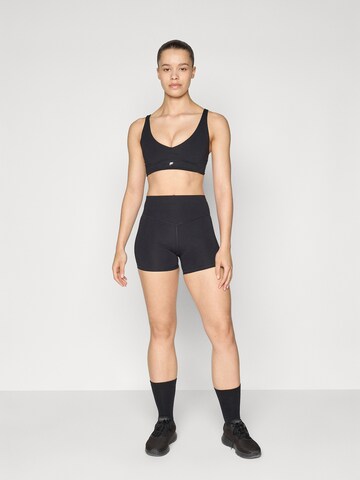 Fabletics Bustier Sportmelltartók 'PURELUXE' - fekete
