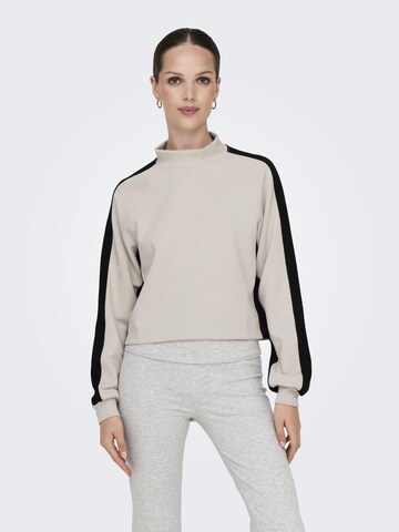 Sweat de sport ONLY PLAY en beige : devant