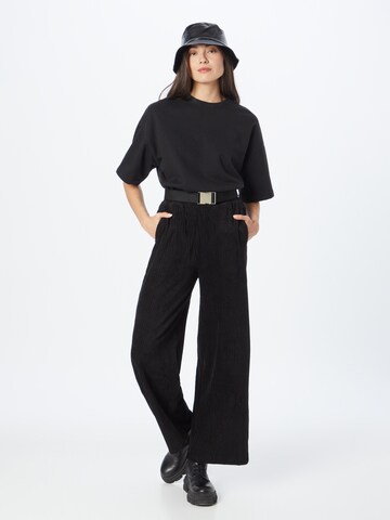 Urban Classics Zvonové kalhoty Kalhoty – černá