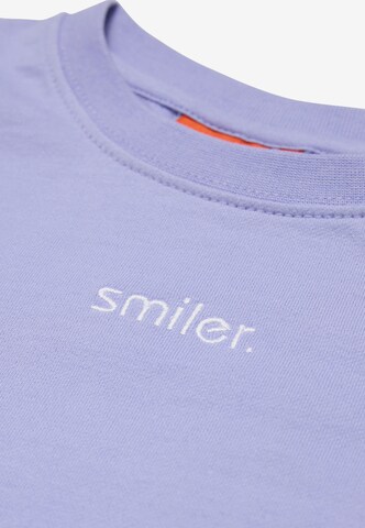 T-Shirt smiler. en violet
