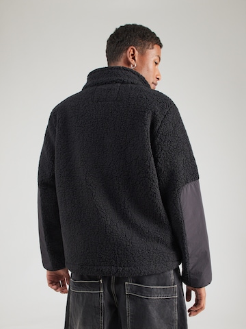 ALPHA INDUSTRIES - Chaqueta polar 'Sherpa Zip' en negro