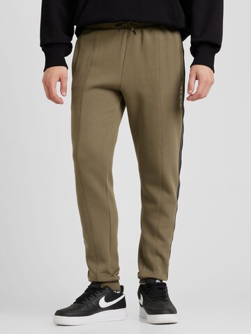 Effilé Pantalon 'Mickey' GUESS en vert : devant