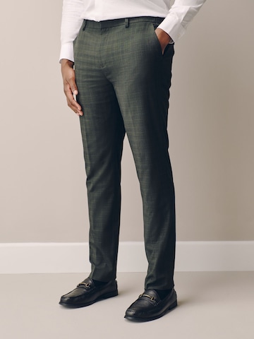 Slimfit Pantaloni con piega frontale 'Motionflex' di Next in verde: frontale