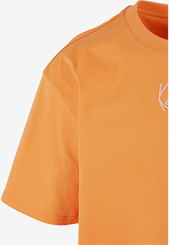 Karl Kani Koszulka 'Essential' w kolorze pomarańczowy
