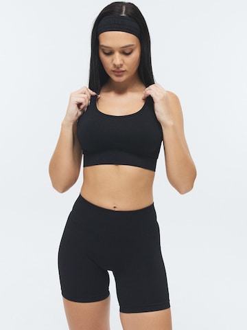 DRILLS Apparel Skinny Leggings 'XFUNCTION Scrunch Shorts' in Zwart: voorkant