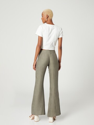 Bella x ABOUT YOU Flared Pants 'Phillipa' in Green