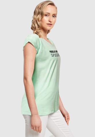 T-shirt 'Spring - Feels like' Merchcode en vert