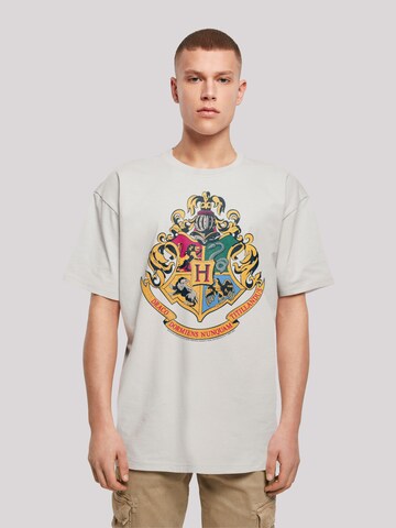 F4NT4STIC Shirt 'Harry Potter Hogwarts Crest Gold' in Grau: Vorderseite