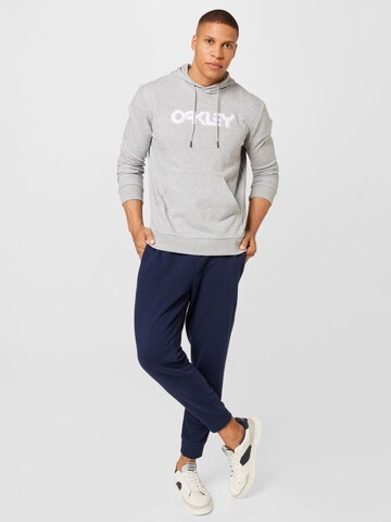 OAKLEY - Sweatshirt de desporto 'TEDDY' em cinzento