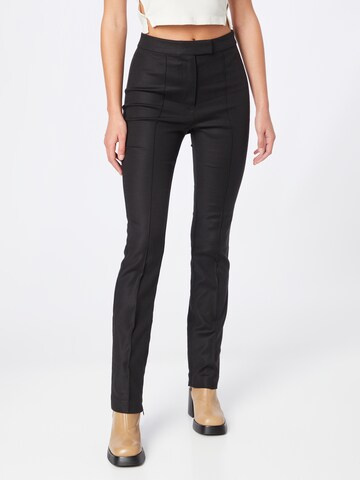 Oval Square Skinny Pleated Pants in Black: front