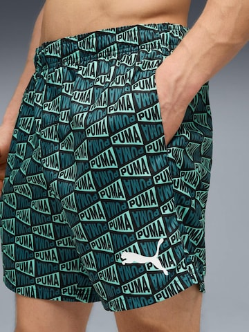 regular Pantaloni sportivi 'Puma Swim Men Printed Flag Mid Shorts 1p' di PUMA in blu