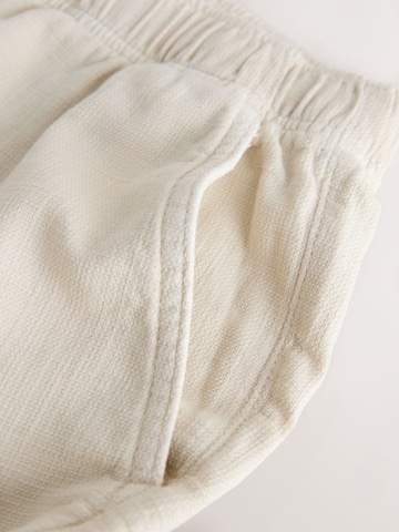 Next Ohlapna forma Hlače | bela barva