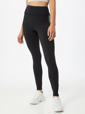 UNDER ARMOUR - Skinny Calças de desporto em preto: frente