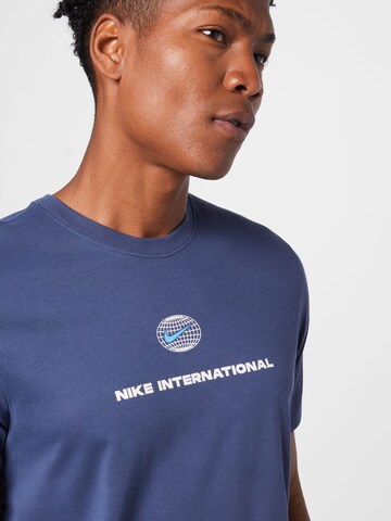 NIKE - Camisa funcionais 'Heritage' em azul