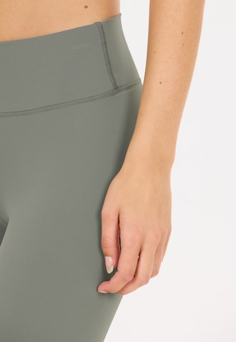 Athlecia Skinny Workout Pants 'Luxe' in Brown