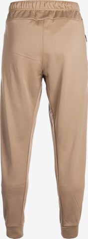 NIKE Loose fit Workout Pants in Beige