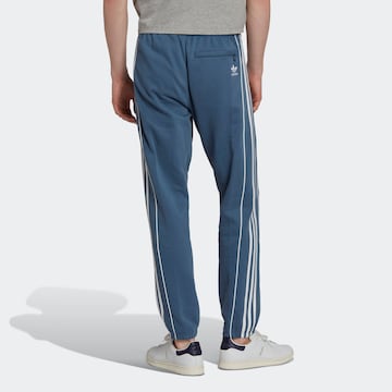 Tapered Pantaloni 'Rekive' di ADIDAS ORIGINALS in blu