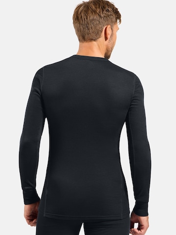 Base layer 'ACTIVE WARM UNI HERITAGE' di ODLO in nero