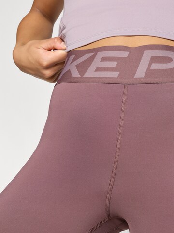 NIKE Skinny Sportbroek in Lila