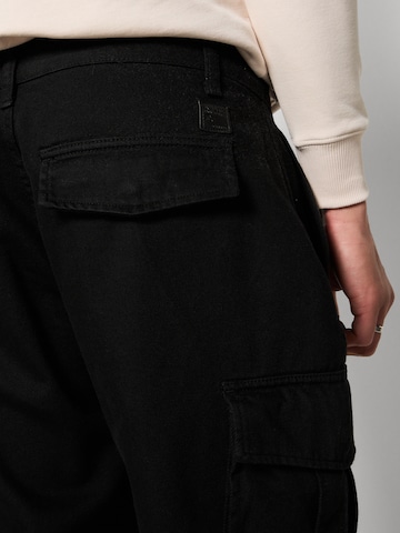 ALPHA INDUSTRIES Loosefit Cargobyxa 'Aircraft' i svart
