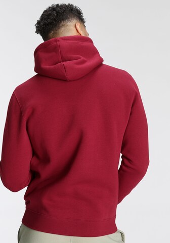 Champion Authentic Athletic Apparel Sweatshirt in Red