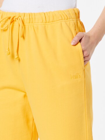 LEVI'S ® Конический (Tapered) Штаны 'Levi's® Women's WFH Sweatpants' в Оранжевый