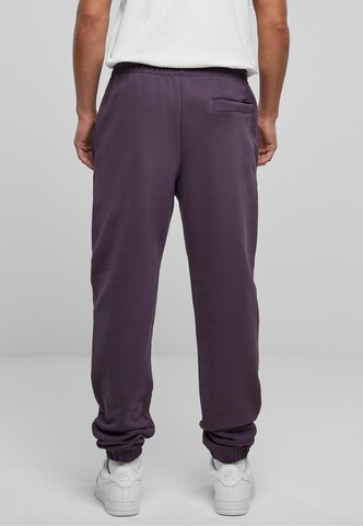 Tapered Pantaloni di Urban Classics in lilla