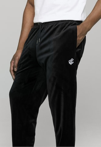 ROCAWEAR Zwężany krój Spodnie 'Austin' w kolorze czarny